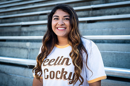 A transfer student proudly wearing a Feeling Cocky t shirt