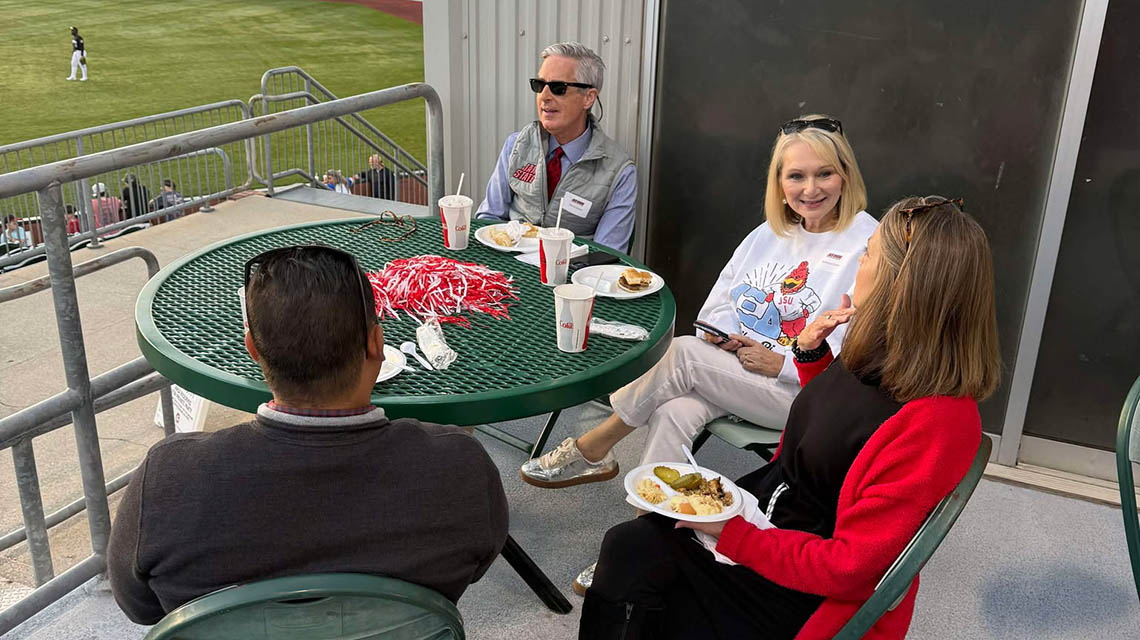 Alumni grabbing a quick bite to eat at the Lookouts game