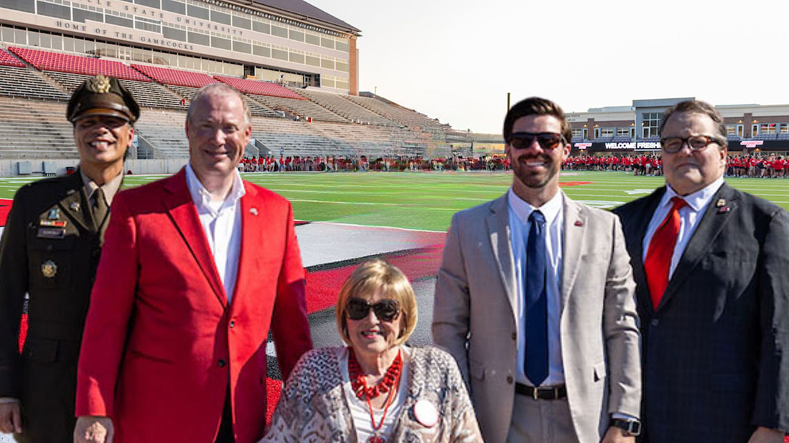 2023 Alumni of the Year, standing together on Burgess-Snow Field on Homecoming