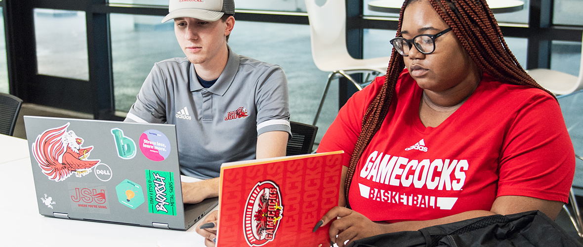 Two students study together on the twelfth floor of the Houston Cole Library