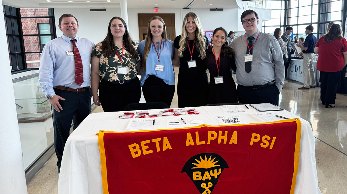 Beta Alpha Psi faculty advisor John Sudduth and officers Leila Price, Reporter; Allie Thompson, Secretary; Mary Katherine Jones, Vice President; Angelica Vargas, Treasurer; and Chase Gilbert, President