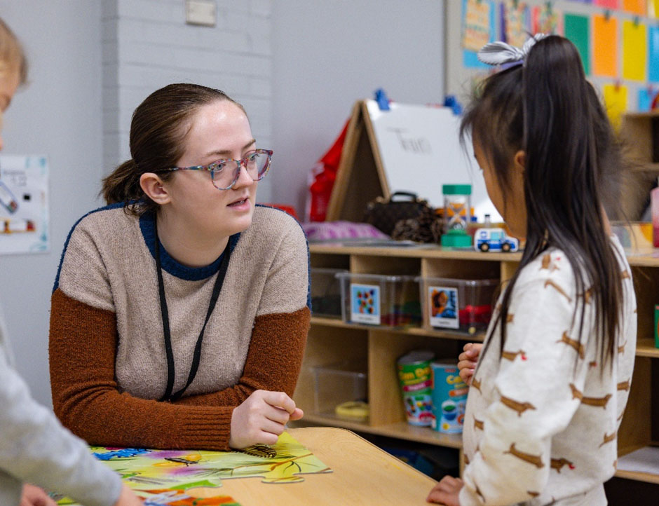 Teacher interacting with child