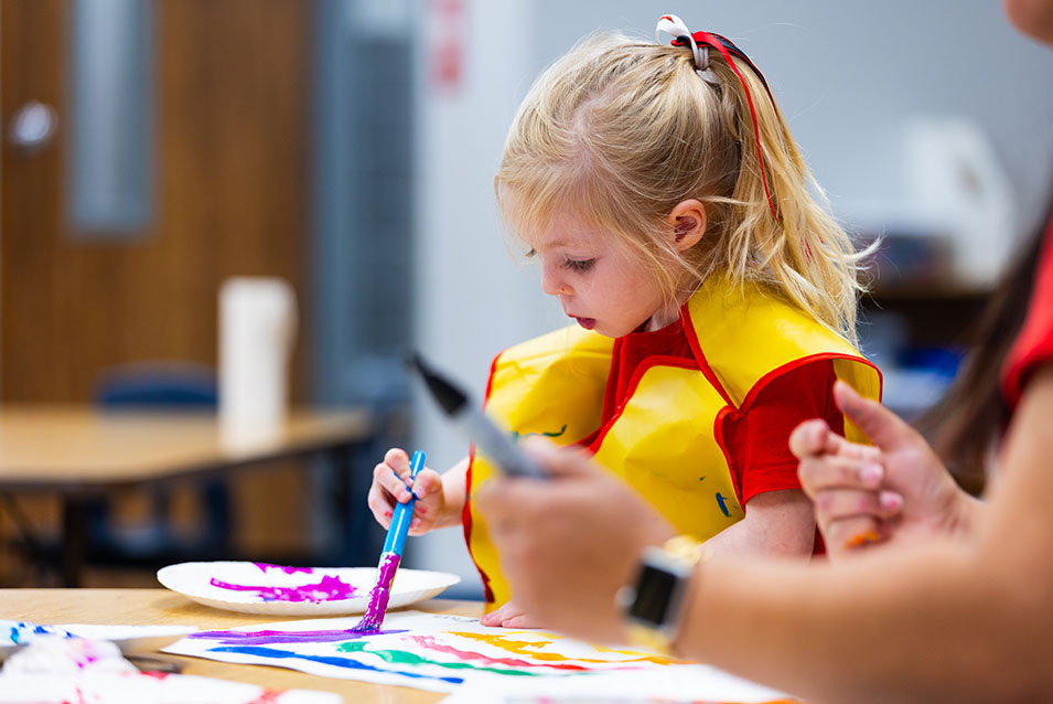 A child painting at school