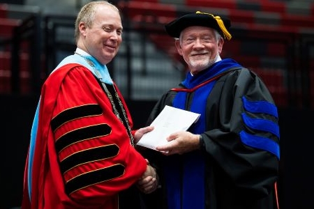 Dean Turner receiving Emeritus Dean at commencement
