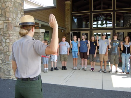 Junior Rangers being sworn in at the entrance to the Canyon Center
