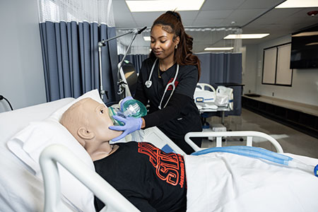 Respiratory Therapy student practices on simulation mannequin