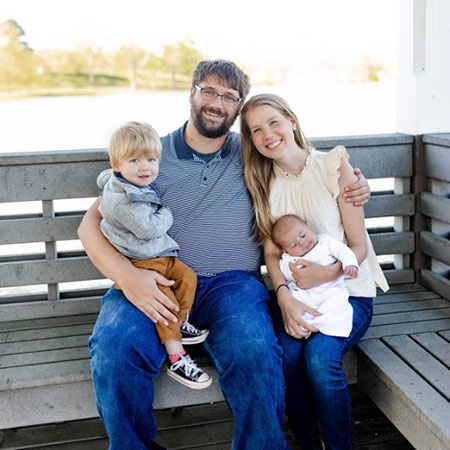 Andrew and Courtney Newsome, along with their two children