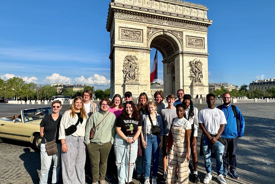 The class gathered in front of the Arc de Triomphe in Paris for another group shot.