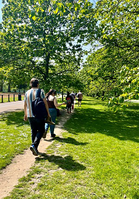 A group of students walking in St. James Park.