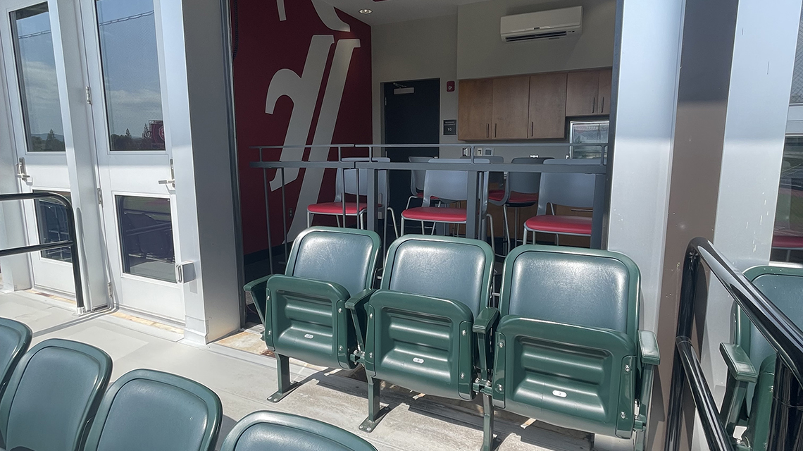View of the exterior seating in a baseball suite at Jim Case Stadium