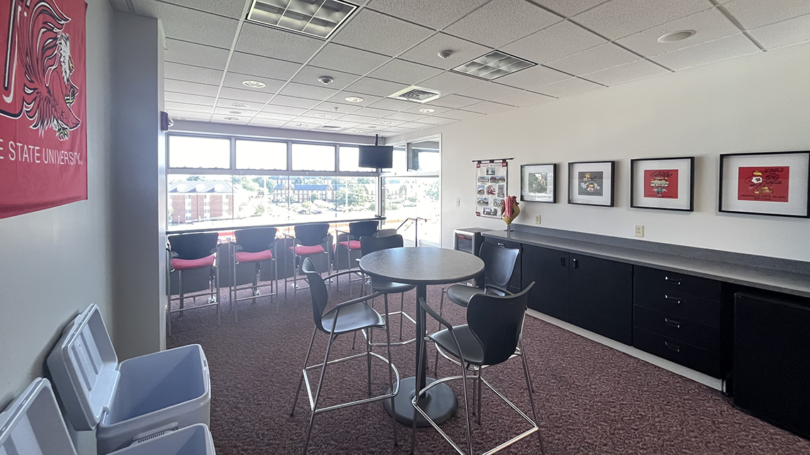 interior of a suite, its walls decorated with JSU images