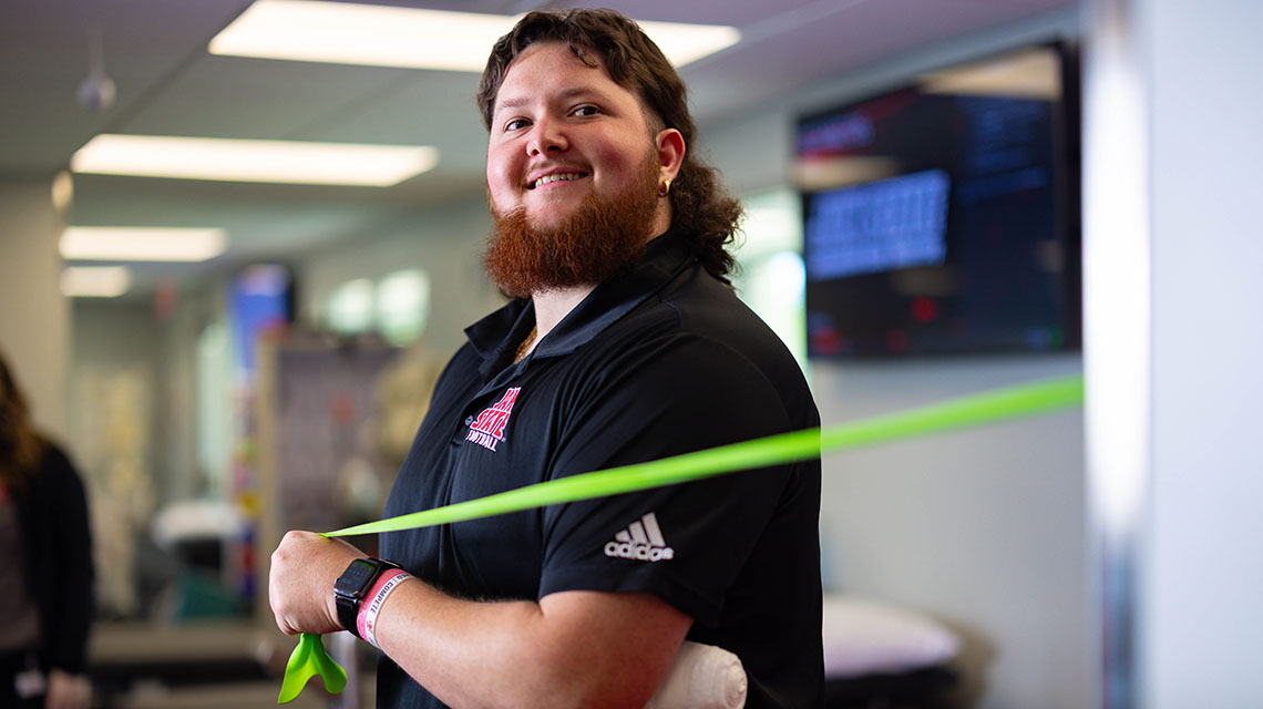 MAT student with a resistance band