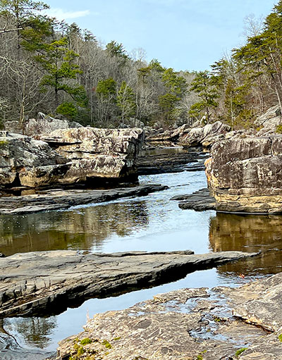 Water flows among huge boulders in the Little River Canyon