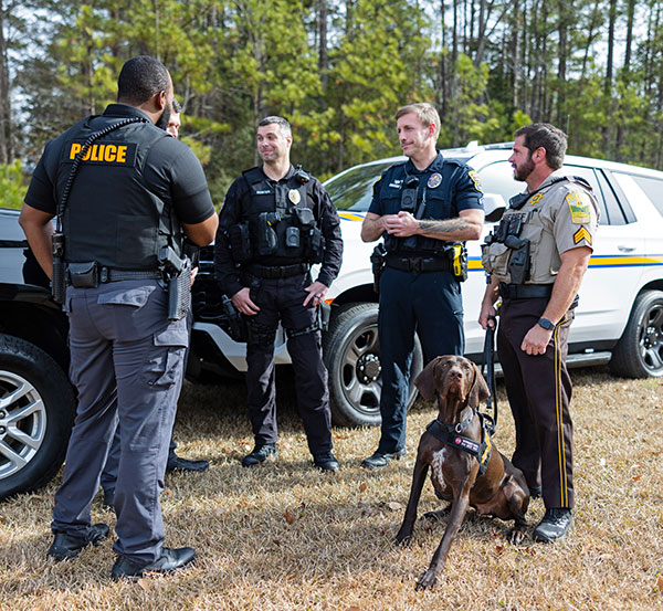 Law enforcement leadership and a K-9 colleague