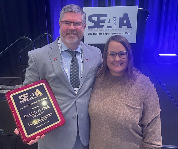 Chris Clark receiving award