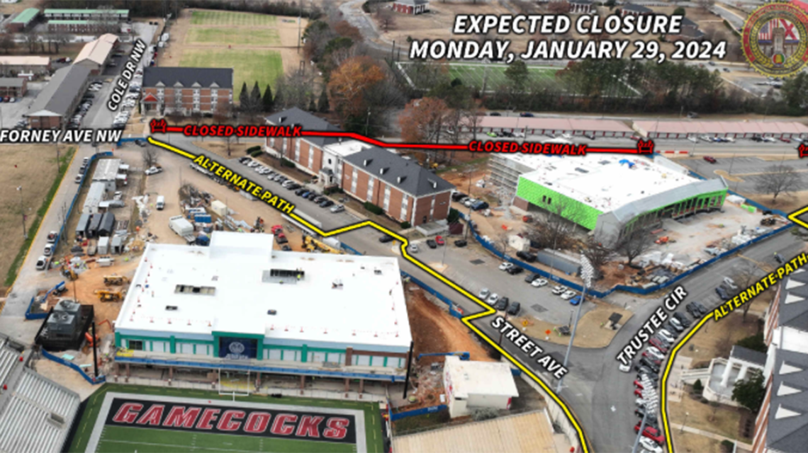 aerial view of forney avenue from Salls Hall to the western edge of the new dining hall construction site depicting the closed sidewalk on Forney between those areas. Also shown is the alternate pedestrian path, which begins in front of Salls Hall, up Street Avenue, and left onto Trustee Circle. 