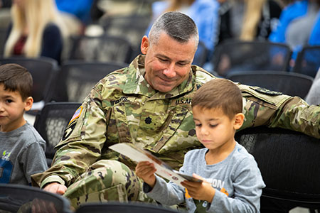 A service member with his son