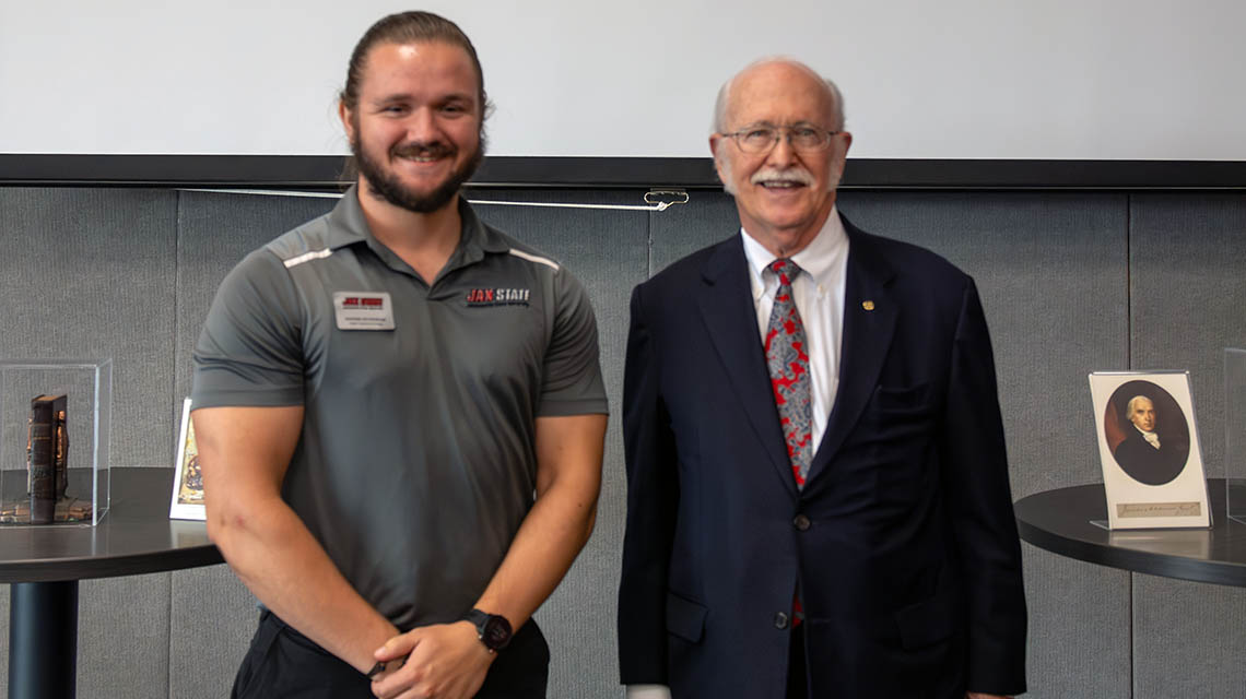 Political Science major and History/Economics minor Hayden Richardson and Chief Justice Tom Parker