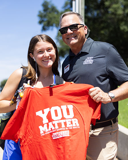 Terry Casey handing out You Matter shirts