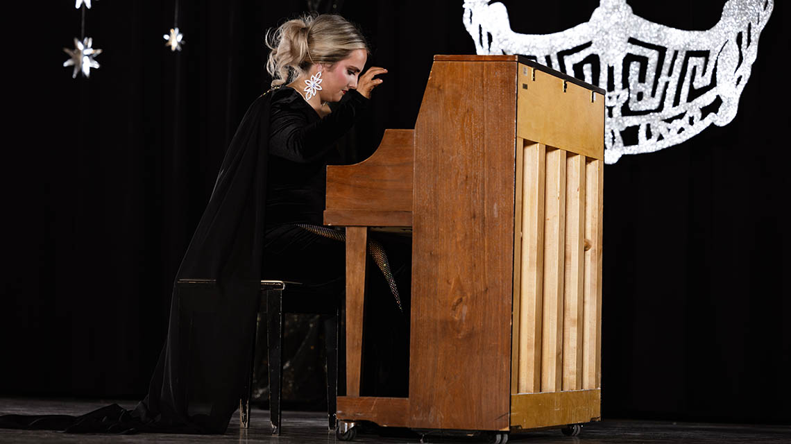 A contestant playing piano
