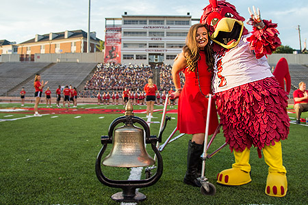 A student with Cocky at Freshman Convocation