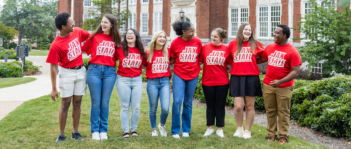 Jax State student admissions counselors gather for a group photo in front of Angle Hall