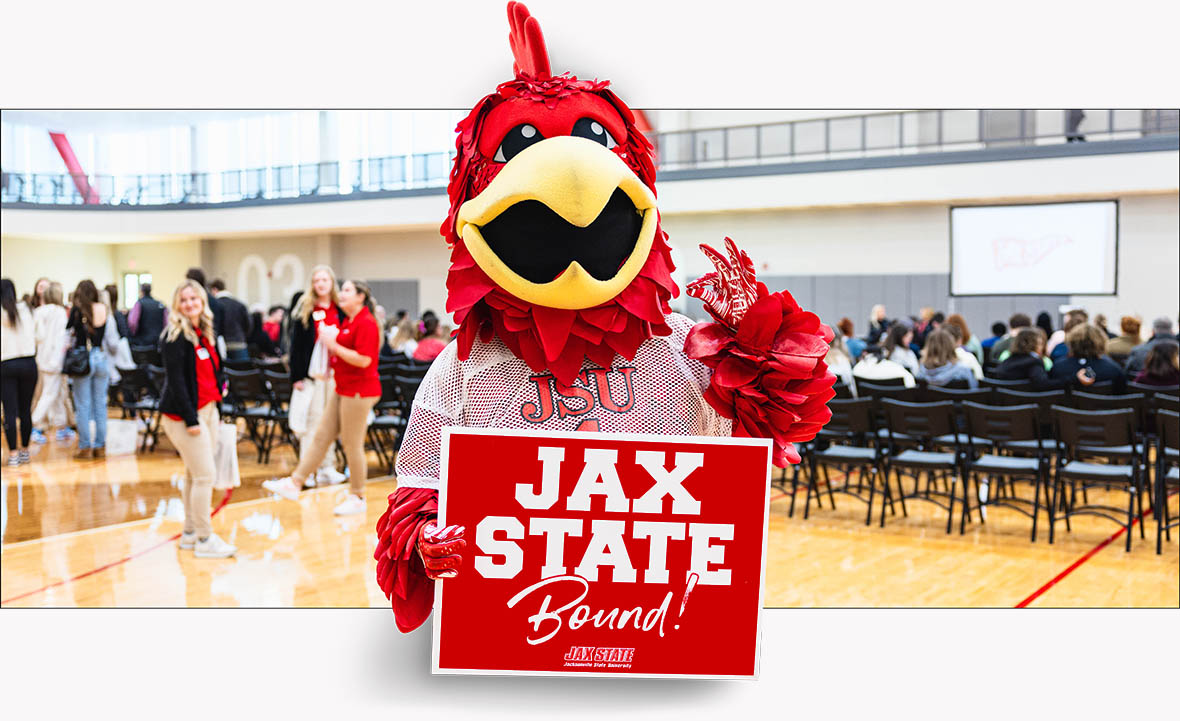 Cocky holding up a Jax State Bound sign