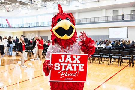 Cocky holding a future Gamecock sign